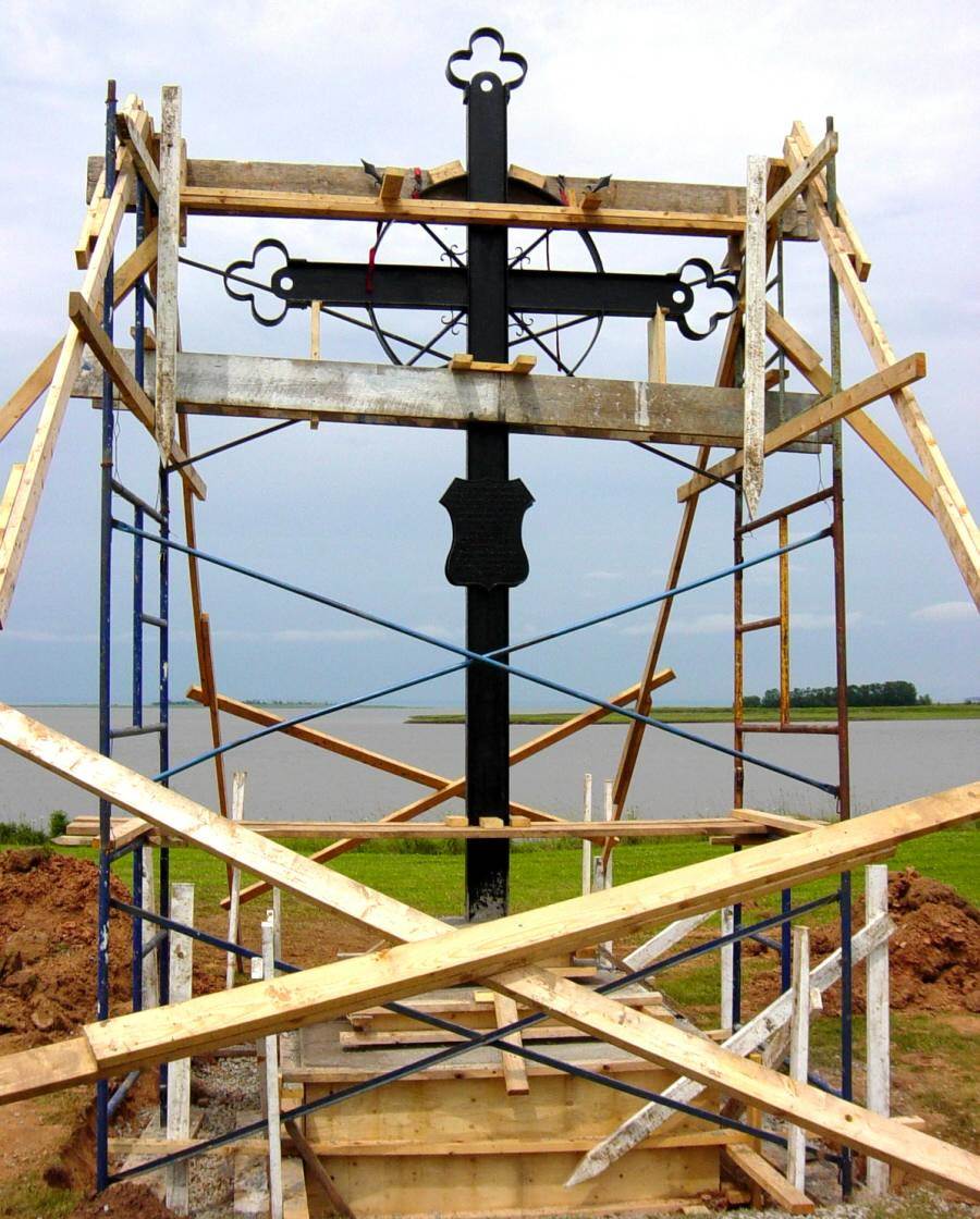 Horton Landing: The Iron Cross being installed at its new location