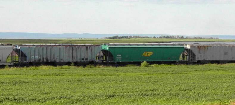 Eastbound freight train passing the Iron Cross monument