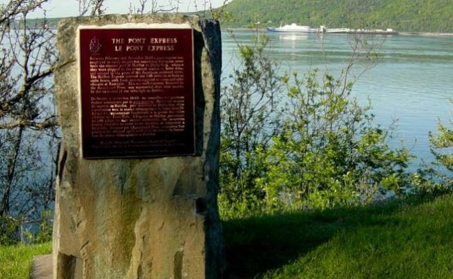 Nova Scotia: 1849 Pony Express monument with ferry at dock -4