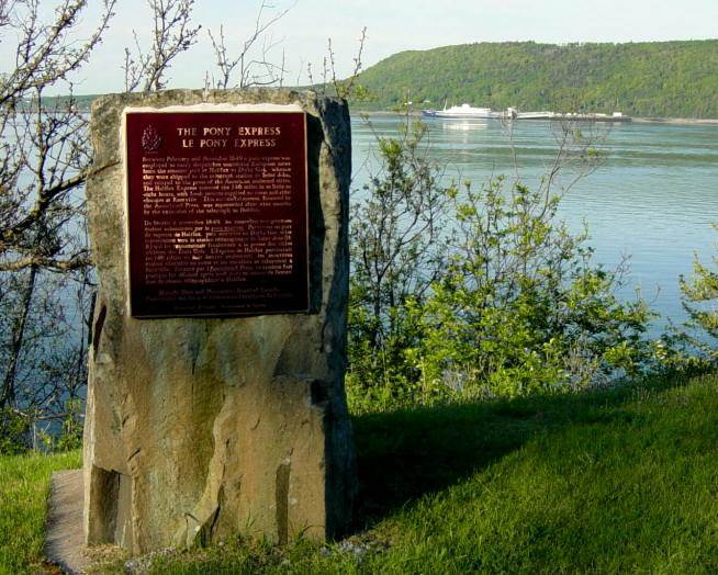 Nova Scotia: 1849 Pony Express monument with ferry at dock -4